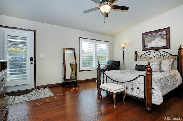 bedroom with lofted ceiling, dark wood-type flooring, ceiling fan, and multiple windows