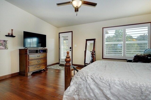 bedroom with ceiling fan, lofted ceiling, and dark hardwood / wood-style floors