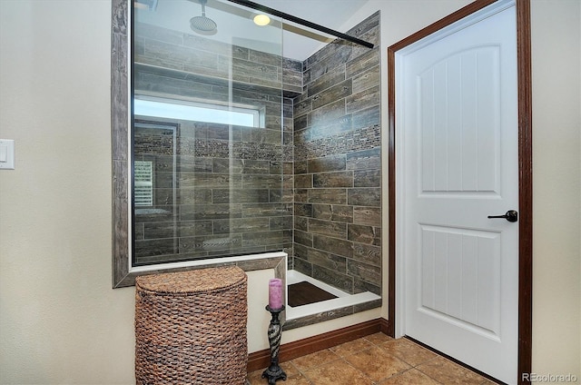 bathroom with a tile shower