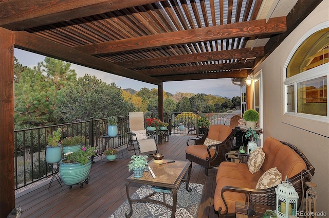 wooden terrace with a pergola and an outdoor living space