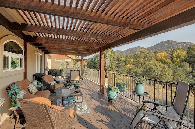 wooden terrace with a mountain view and a pergola