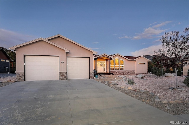 ranch-style house featuring a garage