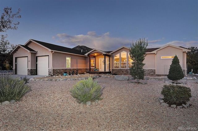 ranch-style home featuring a garage