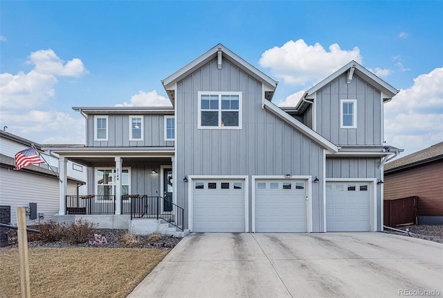 view of front of property featuring board and batten siding, concrete driveway, a porch, and a garage