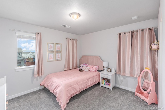 carpeted bedroom with baseboards and visible vents