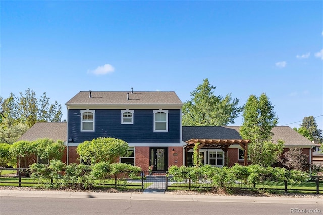 3330 E Tennessee Ave, Denver, CO 80209 - view of front of home featuring a fenced front yard and brick siding