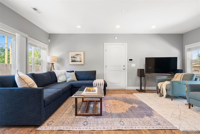 3330 E Tennessee Ave, Denver, CO 80209 - living room featuring wood finished floors, baseboards, and recessed lighting
