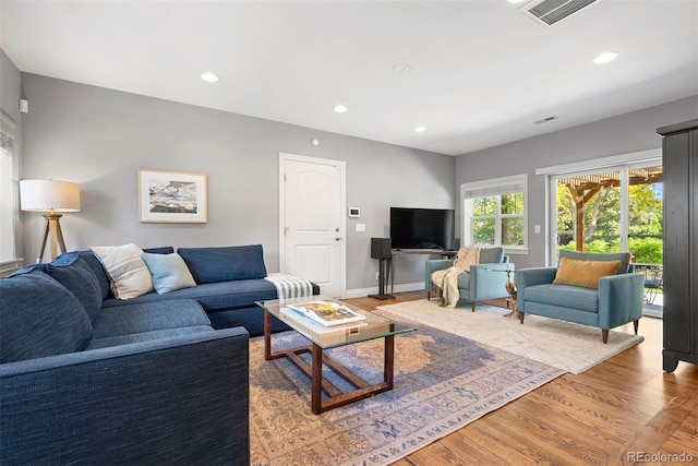 3330 E Tennessee Ave, Denver, CO 80209 - living room featuring recessed lighting and light wood finished floors
