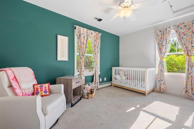3330 E Tennessee Ave, Denver, CO 80209 - bedroom featuring a nursery area, carpet floors, a ceiling fan, baseboards, and baseboard heating