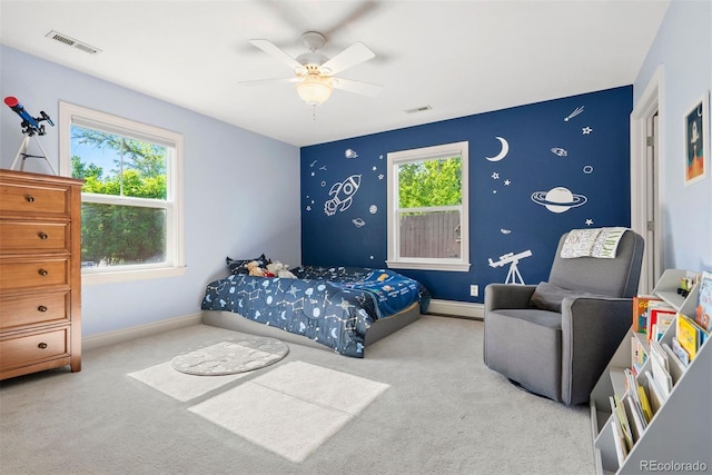3330 E Tennessee Ave, Denver, CO 80209 - carpeted bedroom featuring multiple windows, baseboard heating, ceiling fan, and baseboards