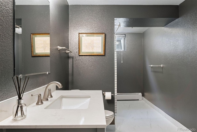 3330 E Tennessee Ave, Denver, CO 80209 - full bath with a baseboard heating unit, marble look tile flooring, toilet, a textured wall, and vanity