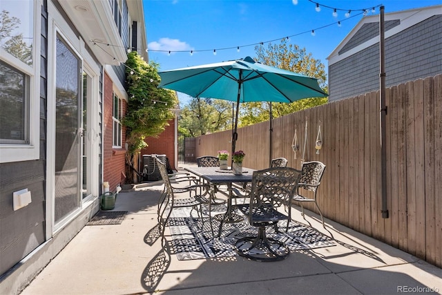 3330 E Tennessee Ave, Denver, CO 80209 - fenced backyard with outdoor dining area and a patio