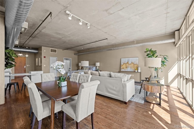 1499 Blake St Unit 2C, Denver, CO 80202 - dining room with wood finished floors and track lighting