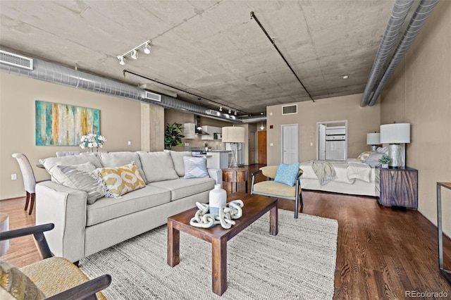 1499 Blake St Unit 2C, Denver, CO 80202 - living area with wood finished floors and track lighting