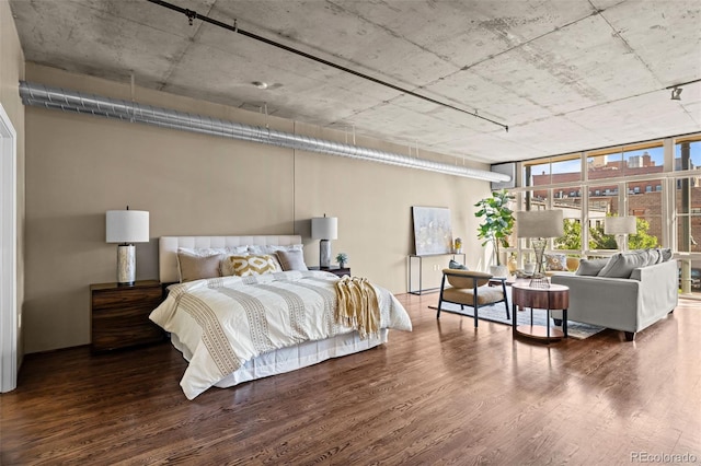 1499 Blake St Unit 2C, Denver, CO 80202 - bedroom with wood finished floors and a wall of windows