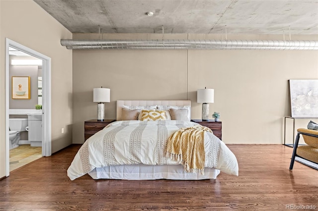 1499 Blake St Unit 2C, Denver, CO 80202 - bedroom with wood finished floors and connected bathroom
