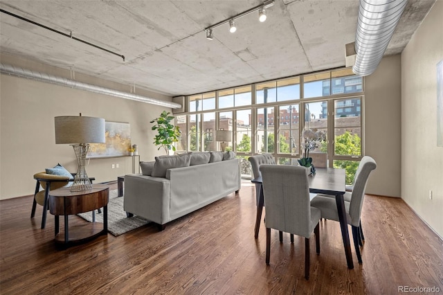 1499 Blake St Unit 2C, Denver, CO 80202 - dining area with wood finished floors, floor to ceiling windows, and track lighting
