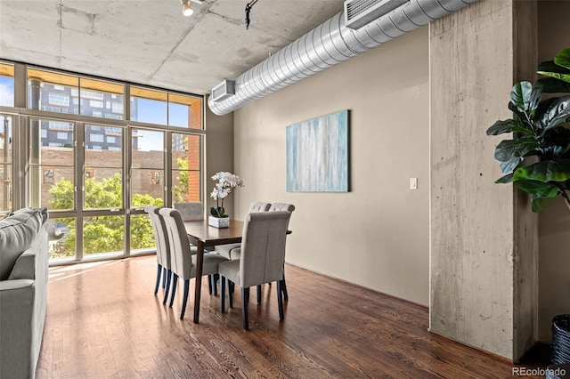 1499 Blake St Unit 2C, Denver, CO 80202 - dining area featuring a wall of windows and wood finished floors