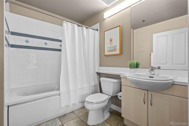 1499 Blake St Unit 2C, Denver, CO 80202 - bathroom featuring vanity, shower / bath combo with shower curtain, and a wainscoted wall