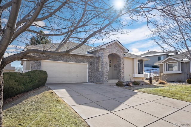 ranch-style home with a garage and a front yard