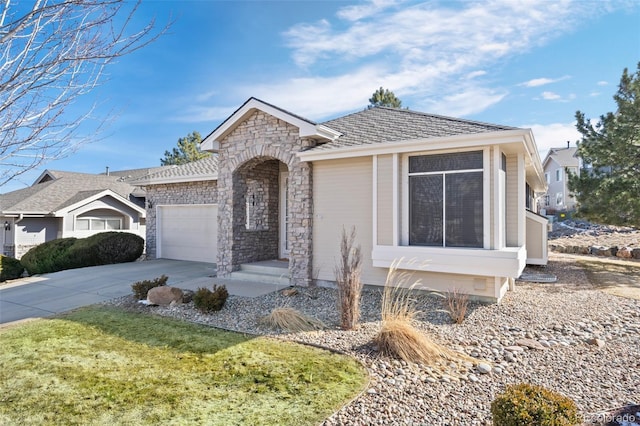 ranch-style house featuring a garage and a front lawn