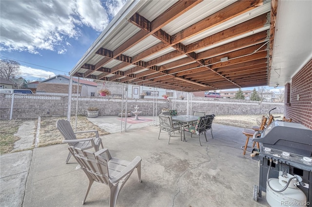 view of patio / terrace featuring outdoor dining area and fence