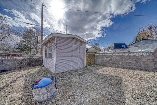 view of outbuilding featuring an outbuilding and a fenced backyard