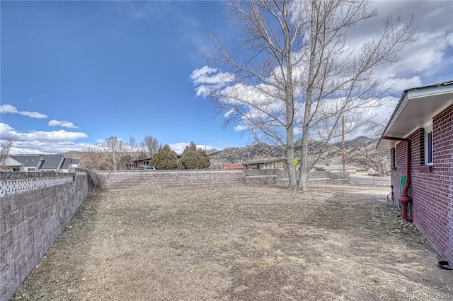 view of yard featuring fence