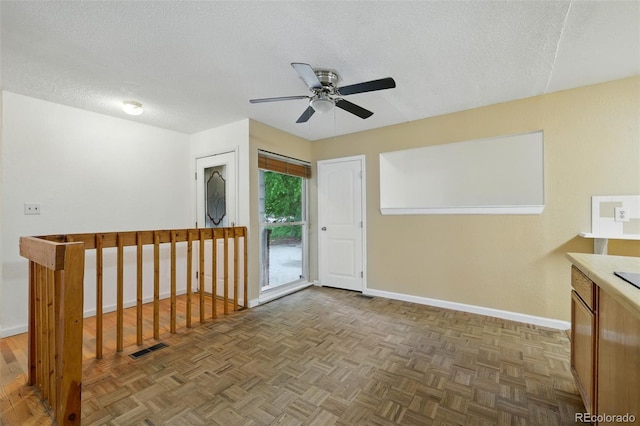 1111 Royale Dr, Colorado Springs, CO 80910 - empty room with a textured ceiling and ceiling fan