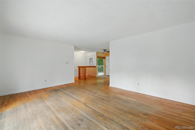 1111 Royale Dr, Colorado Springs, CO 80910 - unfurnished living room with light wood-type flooring and ceiling fan