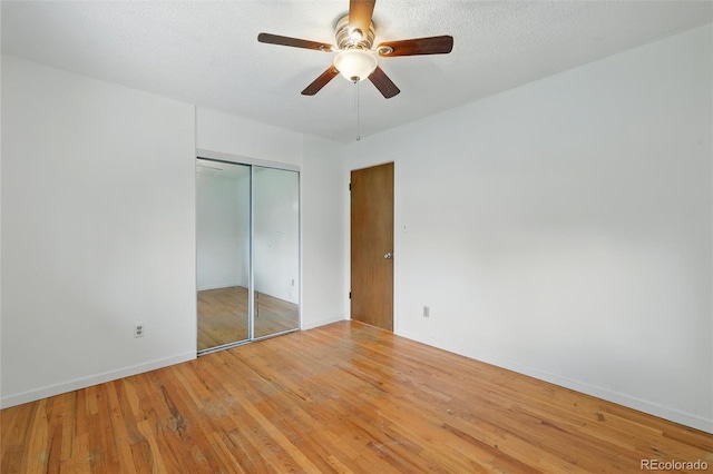 1111 Royale Dr, Colorado Springs, CO 80910 - unfurnished bedroom featuring hardwood / wood-style floors, a closet, and a ceiling fan