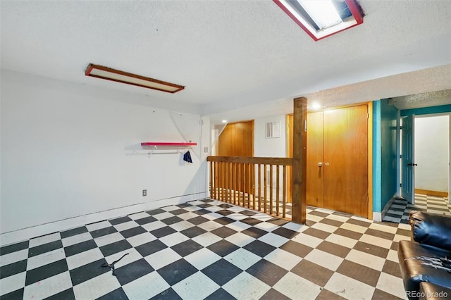 1111 Royale Dr, Colorado Springs, CO 80910 - empty room featuring a textured ceiling and tile patterned floors