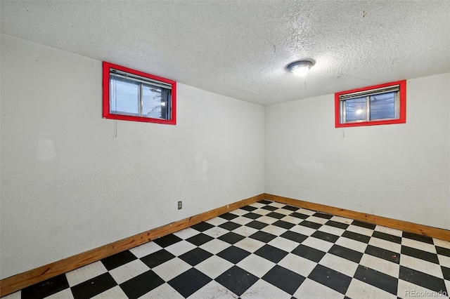 1111 Royale Dr, Colorado Springs, CO 80910 - below grade area with light flooring and a textured ceiling