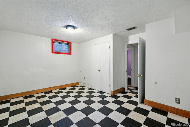 1111 Royale Dr, Colorado Springs, CO 80910 - below grade area featuring light floors and a textured ceiling