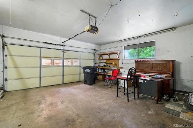 1111 Royale Dr, Colorado Springs, CO 80910 - garage featuring a garage door opener and a workshop area