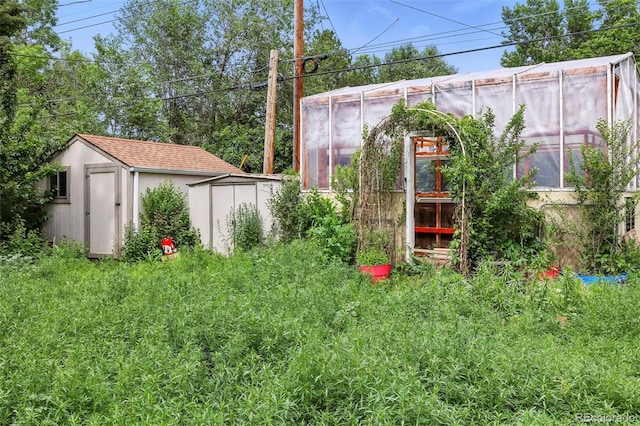 1111 Royale Dr, Colorado Springs, CO 80910 - view of yard featuring a storage unit and an exterior structure