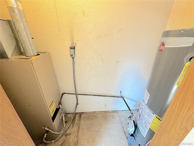 utility room with gas water heater