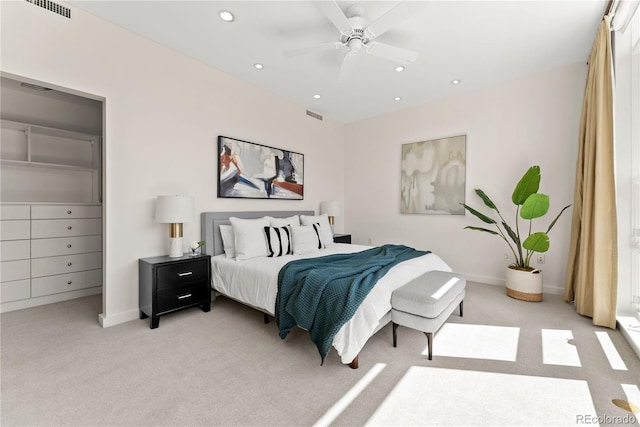 bedroom featuring recessed lighting, visible vents, light carpet, and ceiling fan