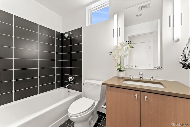 full bathroom featuring tile patterned flooring, visible vents, shower / washtub combination, toilet, and vanity