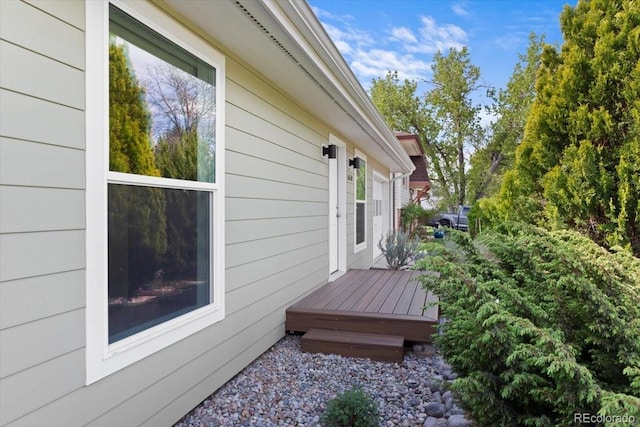 view of property exterior featuring a deck