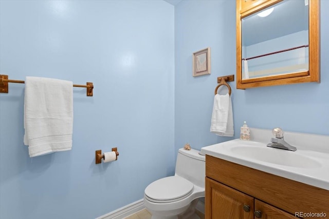 bathroom featuring toilet and vanity