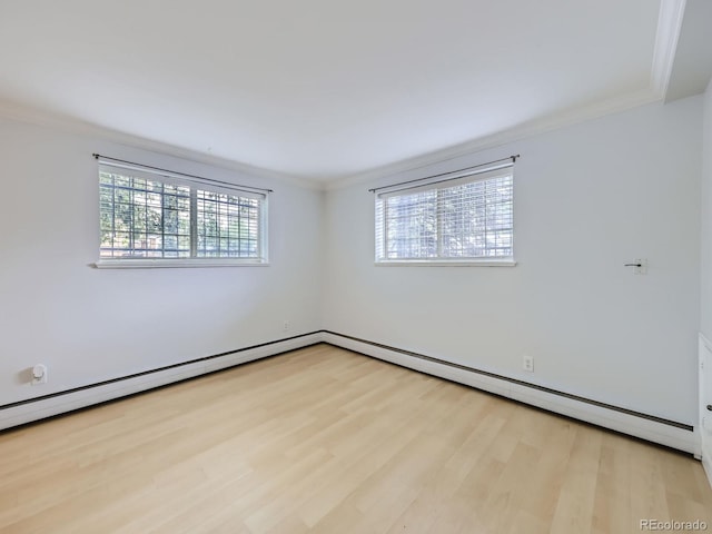 unfurnished room featuring plenty of natural light, wood finished floors, and crown molding