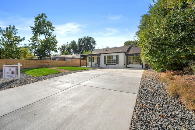 back of house featuring a lawn