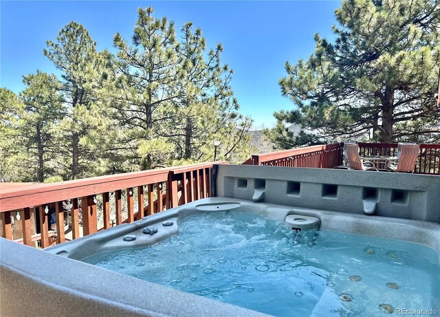 32187 Sylvan Rd, Golden, CO 80403 - view of swimming pool featuring a hot tub and a deck