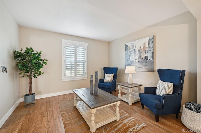 living area with hardwood / wood-style flooring