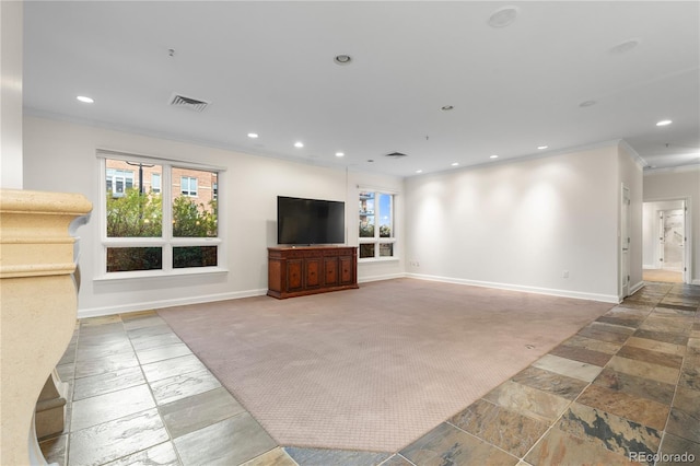 unfurnished living room featuring crown molding and carpet flooring