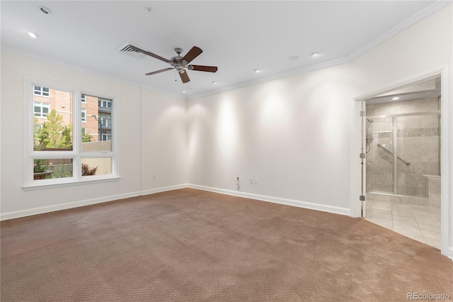 carpeted spare room featuring ceiling fan and ornamental molding