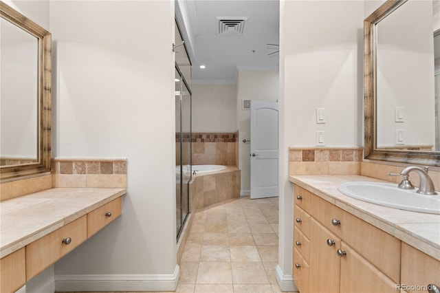 bathroom featuring vanity, independent shower and bath, ornamental molding, and tile patterned flooring