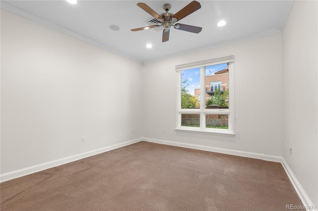 carpeted empty room featuring ceiling fan and ornamental molding