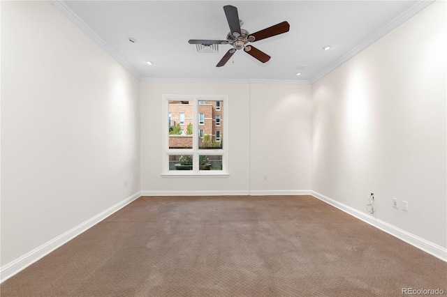 empty room featuring crown molding, carpet flooring, and ceiling fan